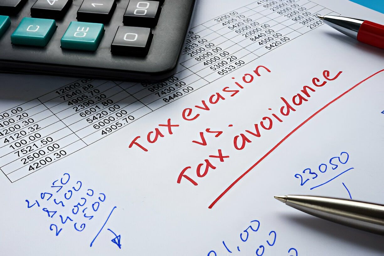 tax-sheet-with-numbers-and-title-written-in-red-tax-evasion-vs-tax-avoidance